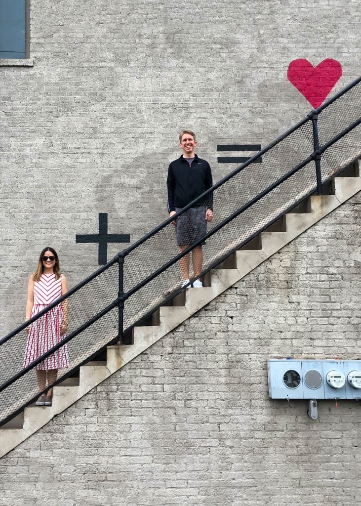 woman and a man on a staircase  depicting husband and wife = love