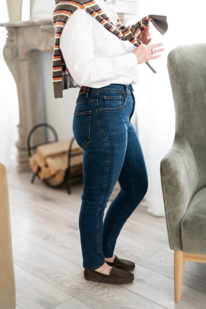 Beth wearing skinny jeans styled with loafers, showing a slim ankle-length fit that works well for petites.