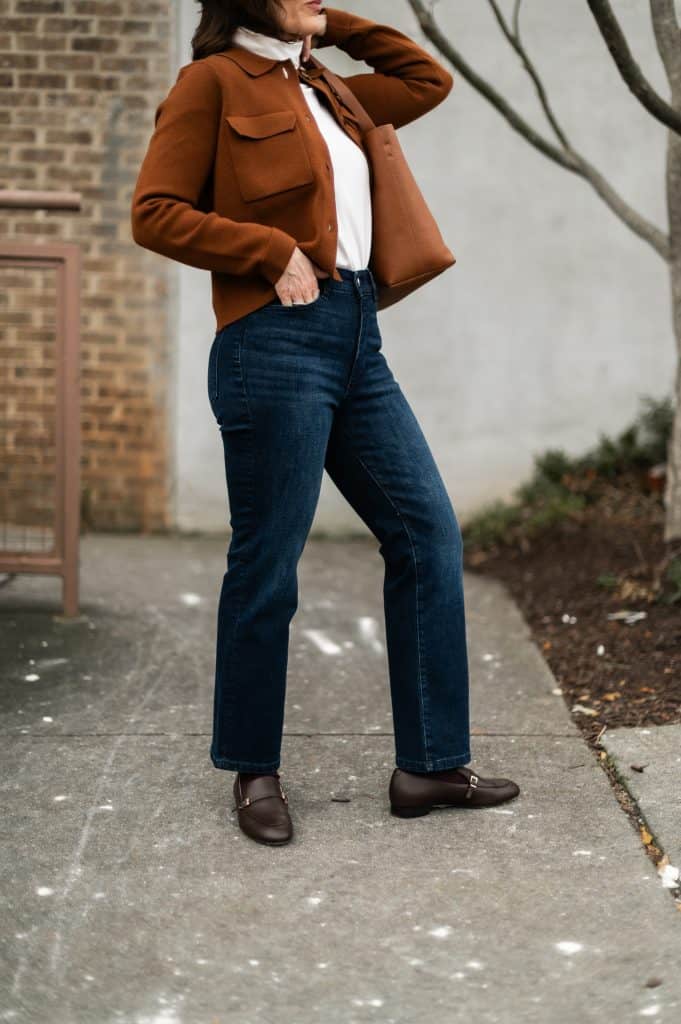 Side view of cropped jeans showing ideal ankle-length hem for petite women in winter.